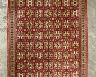        323	Azerbaijani Quba Style Rug	"Azerbaijani Quba style rug. Polychromatic medallions against red and yellow field. ""AZERBAIJAN"" stitched into one corner of rug. Tag on underside of one corner of rug. Staining and small losses to fringe. Losses to dye and creases along edges on both long sides of rug, tear to one side.

8' 1 1/2"" x 10' 4"""
