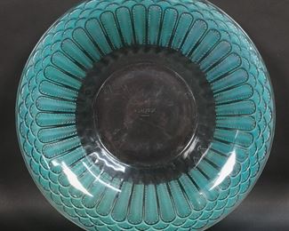        328	R. Lalique Jaffa Coupe Green	R. Lalique Jaffa pattern coupe bowl. Feathered decoration in green, signed with etched R. Lalique France mark to the underside. 2 1/8"H x 12 1/2"-diameter. Scratches to the underside.
     

