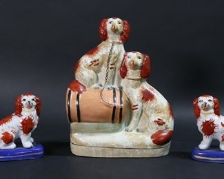        341	3 Staffordshire Porcelain Dogs	3 pieces Staffordshire English porcelain. Pair of dog figurines, each 4 1/4"H; dog figure group, 9"H. Crazing throughout pair of figurines, paint loss to ears; larger figure group paint loss throughout, firing crack to top dog.
