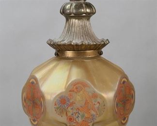        346	Art Deco Hanging Fixture With Parrot Shade	Art deco pendant light. Brass fixture with glass shade. Iridescent hexagonal shade with alternating panels of parrots with flowers and geometric designs. Lightolier shade circa 1920s, with later fixture, hardware and cap. Unsigned. Approximately 16 3/4"L from ring at top, not including lower finial. Shade 3 7/8"-diameter at top fitting. Losses to brass patina, minor losses to original paint decoration on finial.
