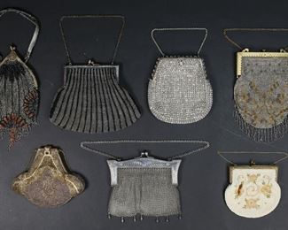        353	7 Beaded & Mesh Bags	7 vintage beaded and mesh purses, including French, silverplate, art deco. All with metal frames, 6 with chain handles, 1 with beaded handle. Silver and gold tone mesh bag 8 1/4"L, chain mail bag 6 1/2"W x 5 1/2"H. All with wear, tears and staining to linings, multi-colored beaded bag and pink beaded bag both with losses to beads throughout,
