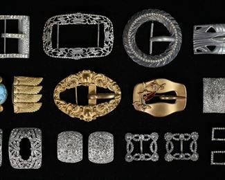        355	Lot of Belt & Shoe Buckles	Lot of belt and shoe buckles. Belt buckles including Paristyle Button Co., gold tone with Egyptian motif and stone scarab, hallmarked Dutch silver; 5 pairs of shoe buckles. Dutch silver buckle 36.26 grams. Scarab buckle 2 3/4"L, silver buckle 3 1/2"L,
