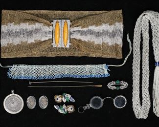        359	Jewelry Lot Including Coro Duette Dress Clips	Lot of jewelry and accessories including pair of Coro duette "Quivering Camellia" trembler dress clips, lorgnette, 2 hat pins, French cz. brooch with cabochons, beaded necklace, beaded belt / necklace, gold and silver tone thread belt with Bakelite and rhinestone buckle, hallmarked sterling silver Aztec calendar pendant. Pendant 40.20 grams. Coro clips each 2 1/4"L, silver and gold tone belt 26 1/4"L. Coro dress clips one missing blue stones and losses to green enamel on both, lorgnette frame cracked and one lens loose, brooch missing stone and section of enamel, beaded necklace missing and loose beads.
