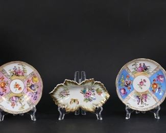        375	5 Pieces Continental & English Porcelain	"5 pieces Continental porcelain, including Meissen and Herend. Royal Copenhagen Saxon Flower pattern triangular relish dish, 8 1/8""L; porcelain dish with gilt and floral rim and English registration mark, 9 1/4""-diameter; 2 Meissen bowls with scenes of musicians, blue crossed swords marks with 2 slash marks on both, each 5 1/8""-diameter; Herend Queen Victoria nut dish, 6""L.

Losses to gilt decoration on English plate."
