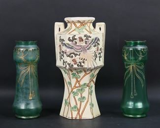       377	3 Vases Bohemian Glass & Moriyama Porcelain	3 vases. Pair of Bohemian satin glass vases with enamel bow decoration, each 9 7/8"H; Moriyama porcelain vase with applied phoenix and leaf decoration, MM Hand Painted mark to the underside, 12 3/4"H. Losses to decoration on Bohemian vases; crazing, loses to gilt decoration on handles, chips to base and underside and flake to rim of Moriyama vase.
