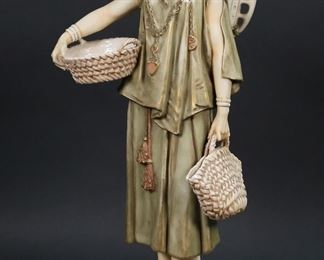        379	Royal Dux Style Porcelain Figure Water Carrier	Porcelain water carrier figure. Royal Dux style, unmarked. 15 1/4"H. Flake to back.
