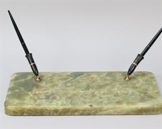        385	Onyx Desk Accessories	Lot of onyx desk accessories, including ashtray with bronze bear, ashtray with bronze ducks, double pen stand. Pen stand 14"L. One pen holder cracked and repaired, flakes and chips to ashtrays, chips to edge of pen stand.
