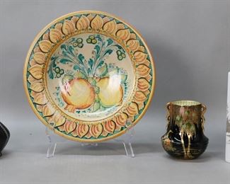        387	5 Pieces Continental & English Porcelain	5 piece porcelain lot. Italian pottery bowl signed A. Zoto Sciacca, 11 7/8"-diameter; 2 Carlton Ware Chinoiserie English porcelain vases, 6 3/8"H and 5"H; Charlotte Rhead vase, 4 3/8"H; Bjorn Winblad for Rosenthal Studio Line vase, 8 1/8"H x 7 1/2"W. Cracks through front, one side and rim of Rosenthal vase.
