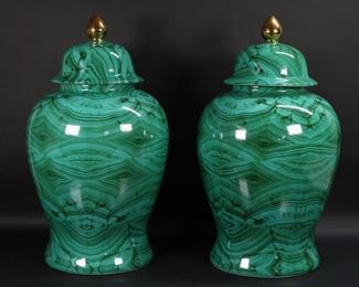        388	Pair of Faux Malachite Porcelain Temple Jars	Pair of large porcelain temple jars / lidded urns. Faux malachite decoration. Each 26 1/2"H. Two small chips to the interior of one lid.
