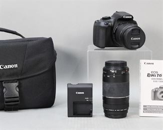        401	Canon EOS Rebel Camera With Zoom Lens	Canon EOS Rebel T6 camera with carrying case, paperwork and Canon zoom lens EF 75-300mm.
