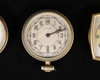        408	Lot of Three Waltham Car Clocks	Grouping of three Waltham automobile clocks including an 8 Days and an 8 Days Pierce. The square-edged clock measures 2 3/4" W x 3/4" D x 3 1/4" H. There is some discoloration and corrosion to faces and hands, as well as external metal corrosion on cases.
