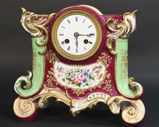        416	Japy Freres Porcelain Mantel Clock	Porcelain mantel clock, with Japy Freres works. Case unsigned, works marked under bell. 9 3/4"W x 5"D x 8 3/8"H. No glass, back cover missing, paint loss to gilt decoration throughout, crazing and discoloration to face, chips to face around key holes, chips to face near III, topper not present, firing cracks to top, minor losses to painted decoration on sides, second hand broken. Untested.
