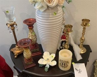 Large vase with florals.  2 gold metal candle holders, 2 different size candle holders. Porcelain magnolia flower. Gruden bobble head. Crystal and gold voltive light
