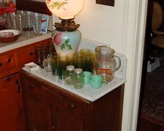 marble top and 1 of many Hurricane lamps, only 2 jadite cups
