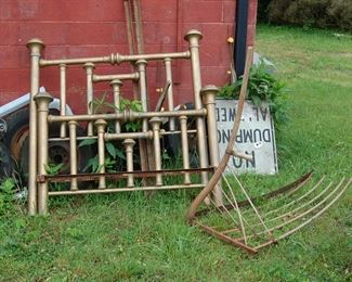 old Brass bed and hay rake