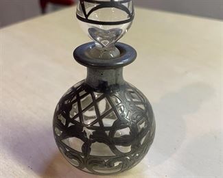 Antique perfume bottle with silver overlay