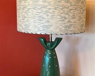 Mid century lamp base suggests a green polka dot dress