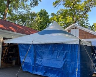 20-Ft by 20-ft big-top circus style tent with side curtains and interior lights. Tent can be moved after sale is concluded.