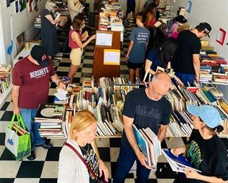 A look at last year's sale.  Our patio will also be full of books in every possible category and genre.
