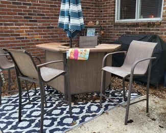 Patio table and umbrella at 4 chairs