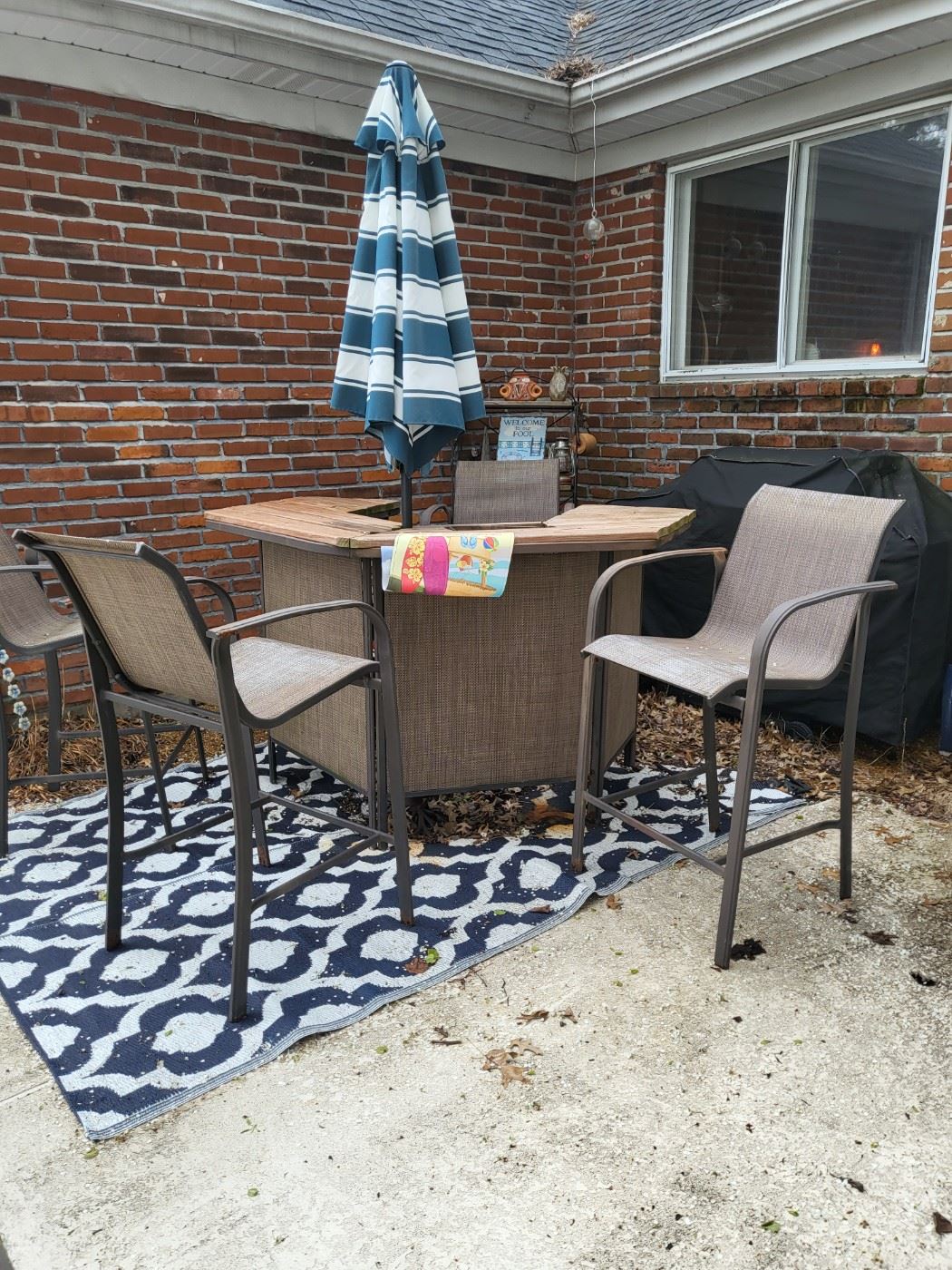 Patio table and umbrella at 4 chairs