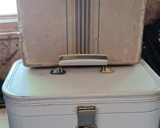 Travel cosmetic bag, and a cardboard child's suitcase