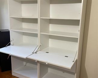2 white shelves with pull-down desk