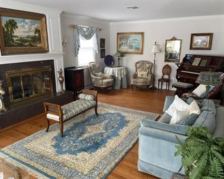 M-C-M living room with bench, carpet, loveseat, organ, occasional chairs mirror, wall art