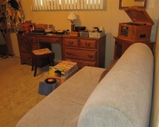 Bedroom/office space. Single folding futon, wood desk and dresser, record cabinet, wood chair, Records/LPs