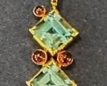 14kt. blue topaz and garnet pendant
