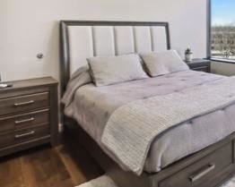 Ashley Furniture queen bed (with storage) and nightstands (2 complete sets) with new queen mattresses