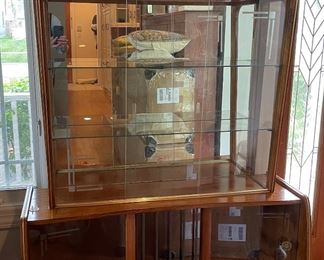 Vintage Mid-Century Modern Bookcase / Display Cabinet With Glass Slider Doors and Mirrored Back. Measures 42" W x 16" D x 55" H. Photo 1 of 4.