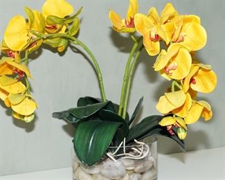 There are several faux floral arrangements available for sale, in all shapes and sizes and with various florals and tropicals