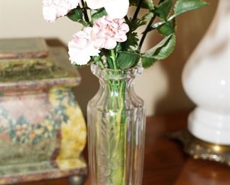 Porcelain roses in crystal vase