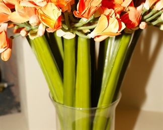Tall faux orange florals in glass vase. By the way, all of the floral arrangements in this home are faux.