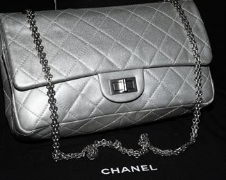 Silver quilted Chanel handbag-this bag is 12" wide. The serial number is 12718321. CASH only! No exceptions.