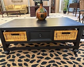 48" x 28" black coffee table with 2 baskets