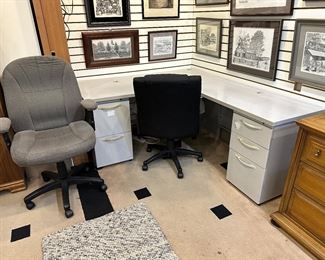 Gray desk and two office chairs