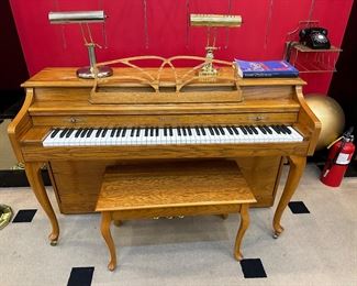 Baldwin spinet 36" high has great tone. 