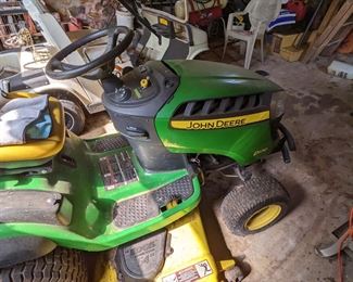 54 inch mower base John Deere with multiple towing carts.