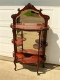 C/1900 Horner Mahogany Étagère approx. 5.6' tall w/bevel mirror, applied carvings, applied brass foliage trim, spindle galleys and original finish, Has Celluloid Label on back