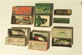 Collection of 9 early wooden fishing lures in original boxes including Southbend, Shakespeare, etc.