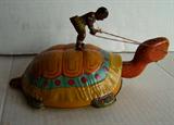 ~ 1930's Native riding a turtle tin wind-up, 8" l.