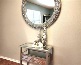 Silver round mirror and silver and mirrored occasional table