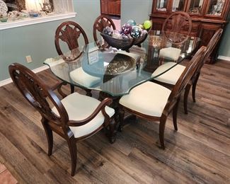 Glass top dining table with double pedestal and six chairs