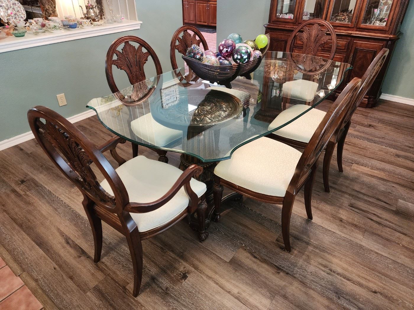 Glass top dining table with double pedestal and six chairs