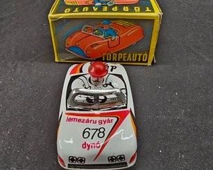 https://www.auctionninja.com/hewitt-estates-and-antiques/product/vintage-tin-toy-car-torpeauto-lemezarugyar-friction-wind-up--1885.html