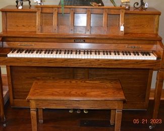 Baldwin upright piano and bench