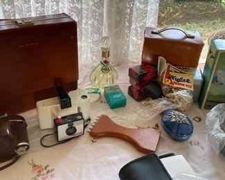 Vintage European perfume, Polaroid & Kodak cameras, microscope 