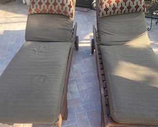 Pair of wooden, cushioned lounge chairs